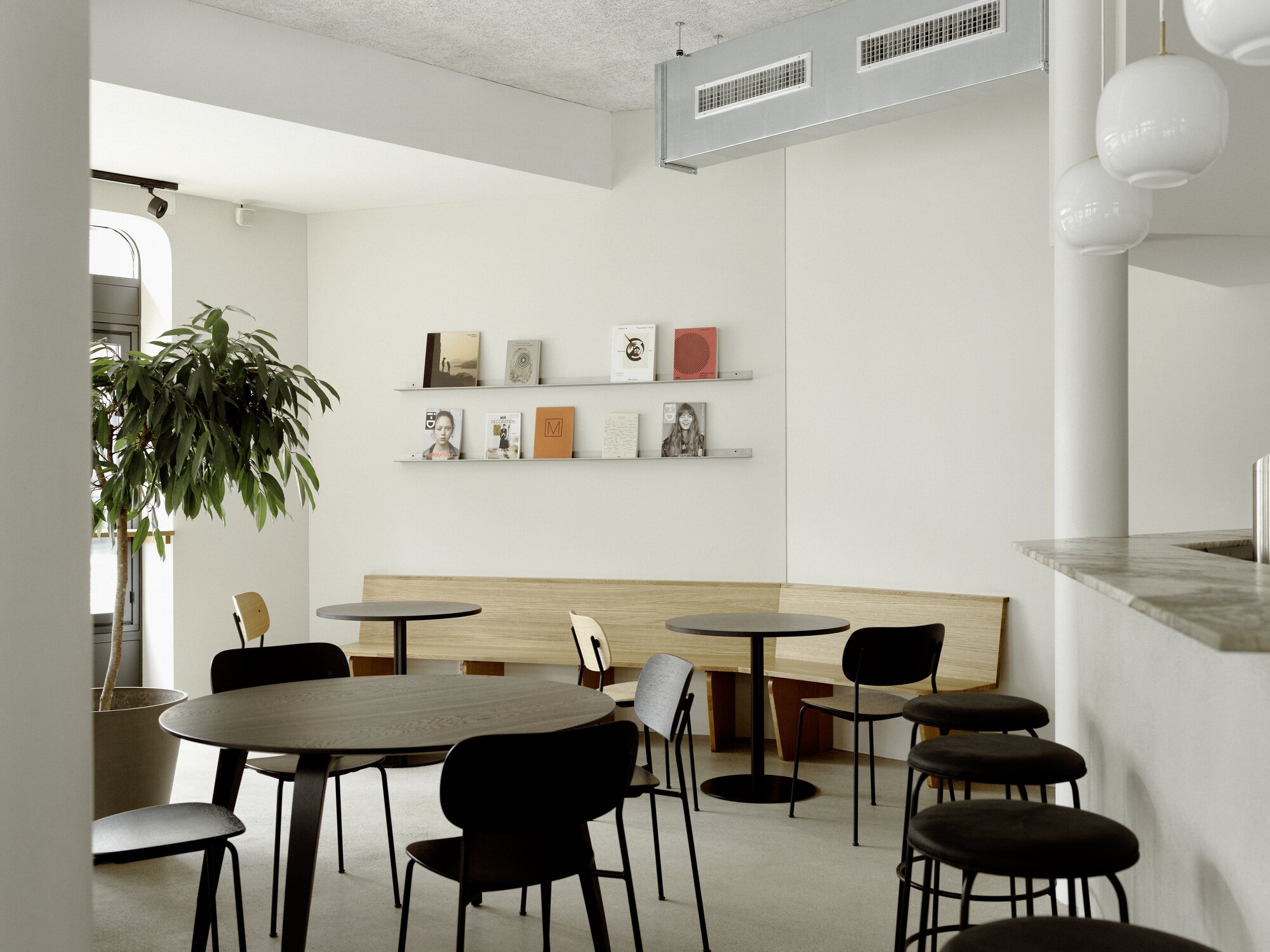 Modern café interior with comfortable seating at HOY St.Gallen