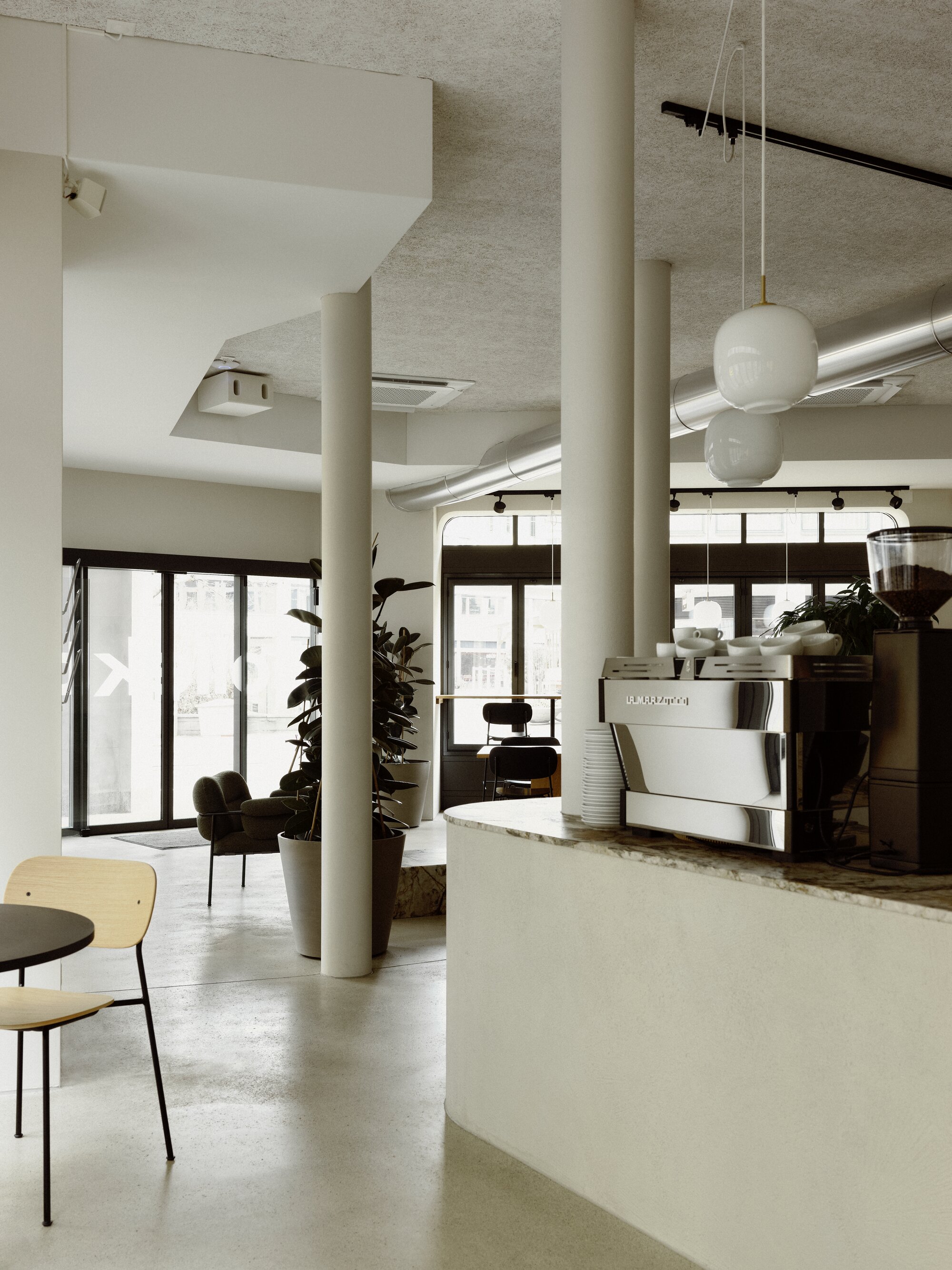 Modern café interior with comfortable seating at HOY St.Gallen